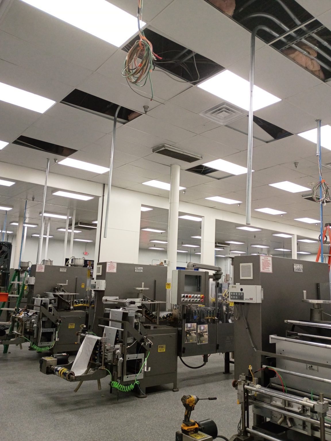Food packaging line with new conduit drops from the ceiling